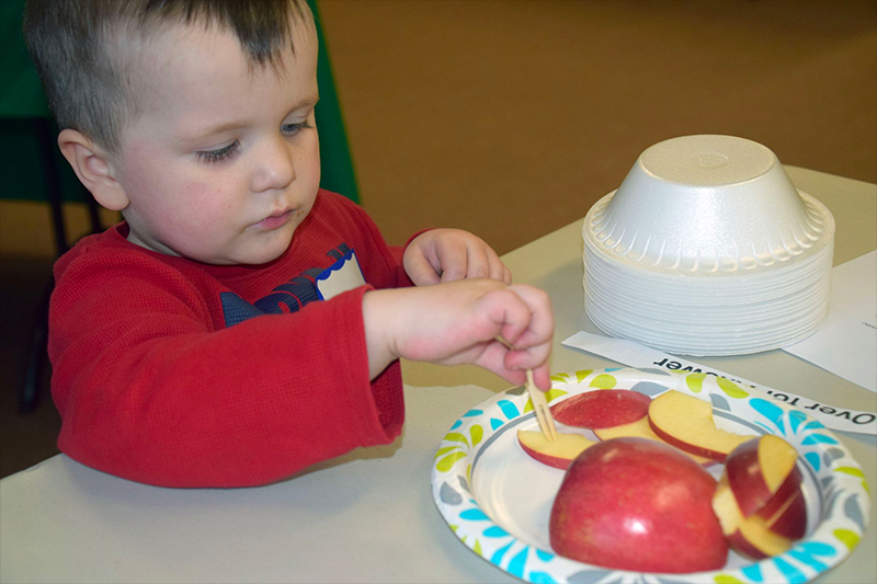 Boy eating apples